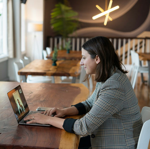 teacher hosting class online while sitting in a coworking space